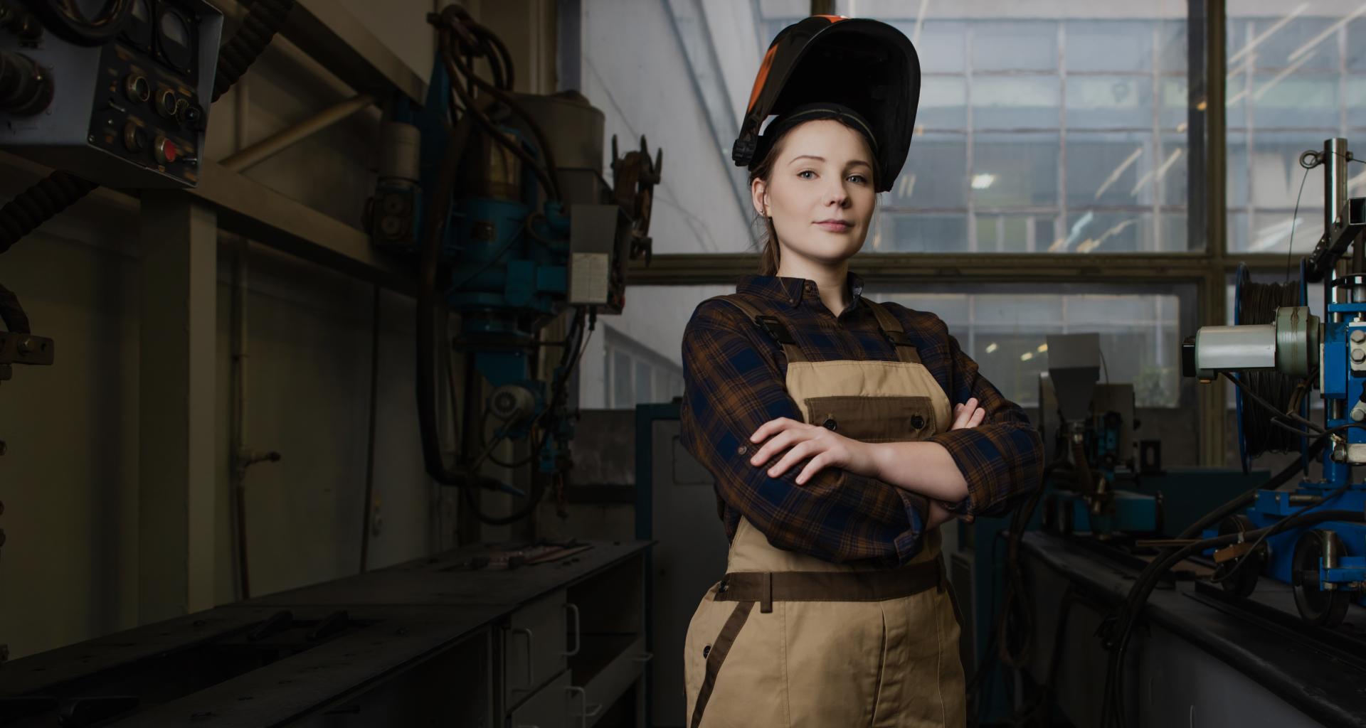 female welder looking at the camera