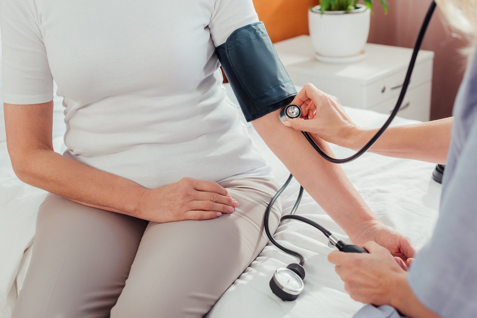 nurse checking blood pressure