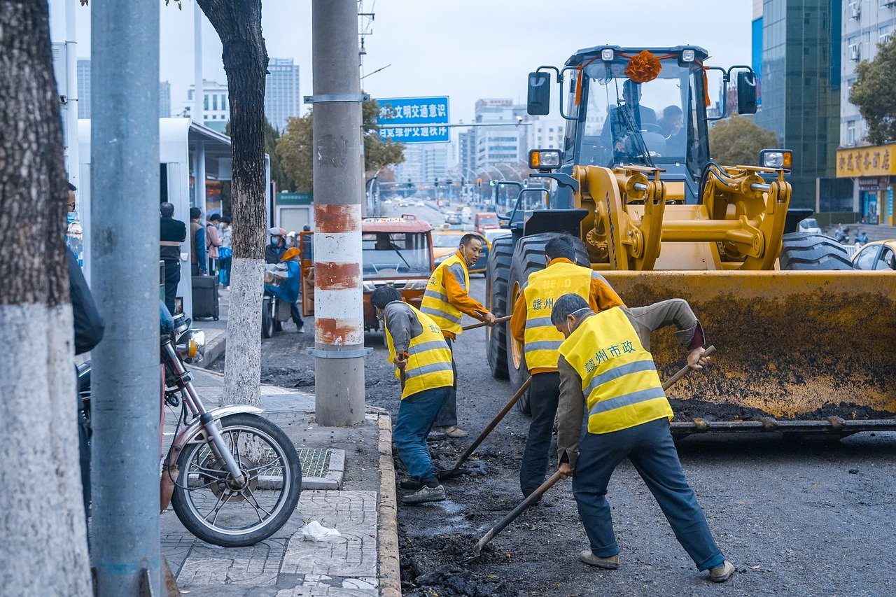 construction employee repairing the road